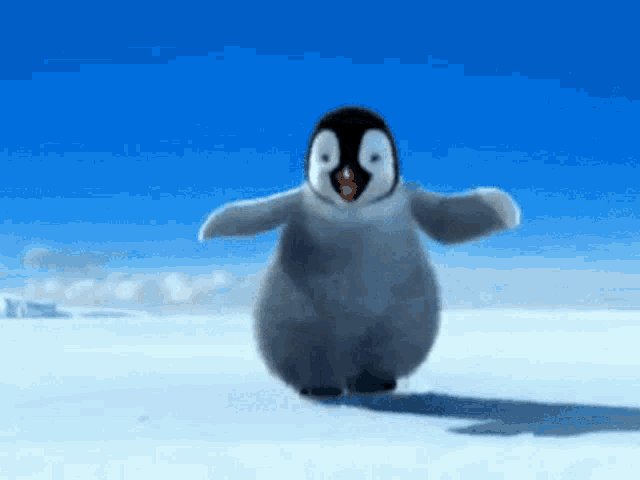 Happy baby penguin dancing on the snow