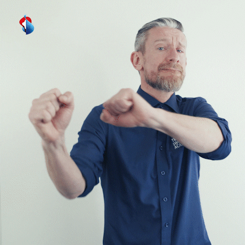 Man in a blue shirt doing an excited celebratory dance meme